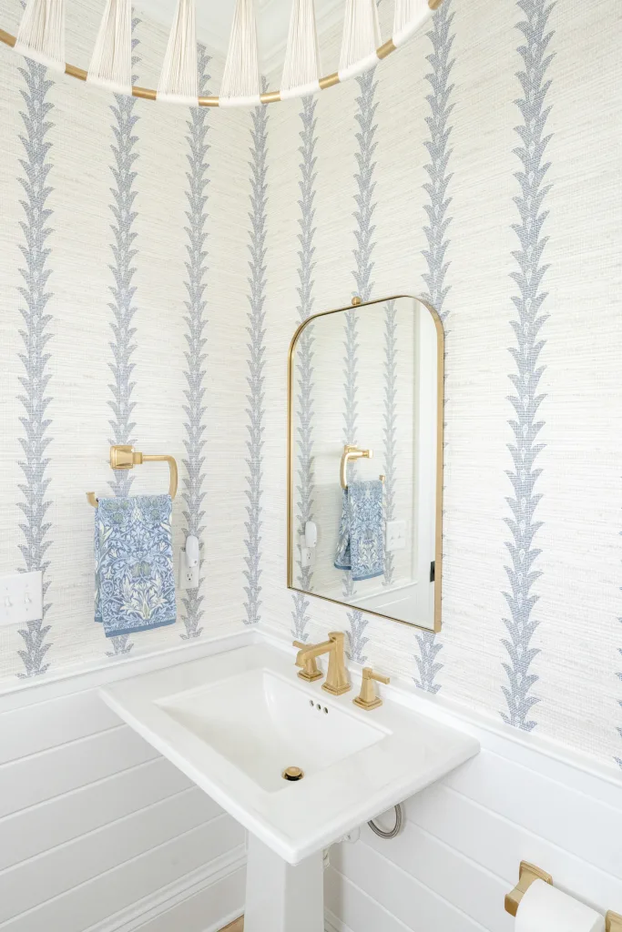 Pedestal sink with brass faucet and striped wallpaper, Charleston powder room