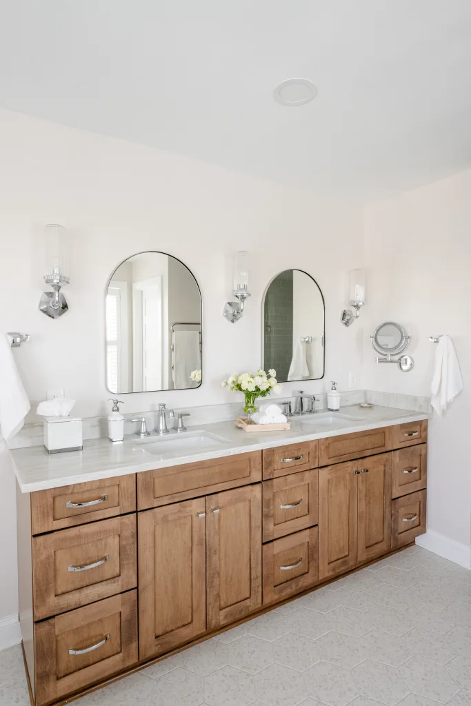 Wood double vanity with arched mirrors and sconces, Charleston bathroom design