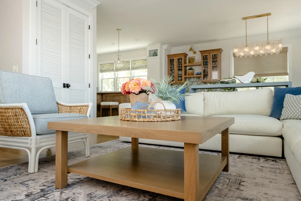 Charleston living room with sectional, rattan chair, and styled coffee table by Ryan-Marie Preuss